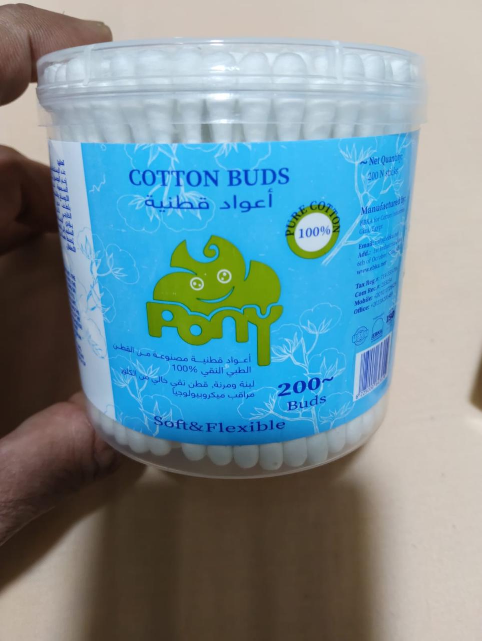 Hand holding a jar of Pony cotton buds, 200 buds